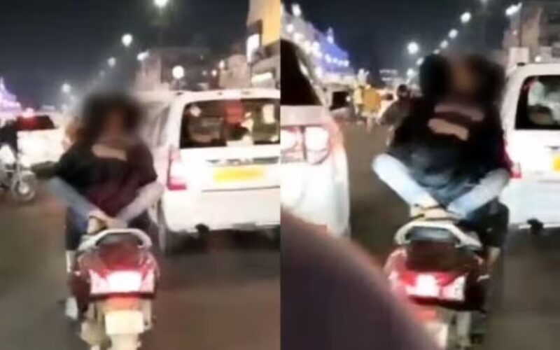 Lucknow News: राजधानी की सड़कों पर बेशर्मी की हदें पार, चलती स्कूटी पर गोद में बैठी लड़की युवक को करती रही किस